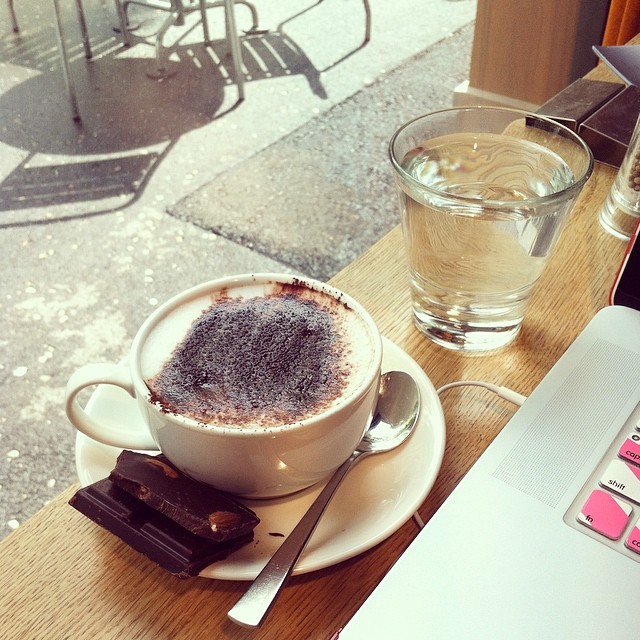 #Cafe time – #cappuccino with almond #stevia #chocolate and some #work to pound through while we wait for the rain to pass!